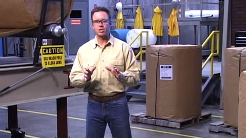 Screen shot of video with man standing with hands pointed forward
