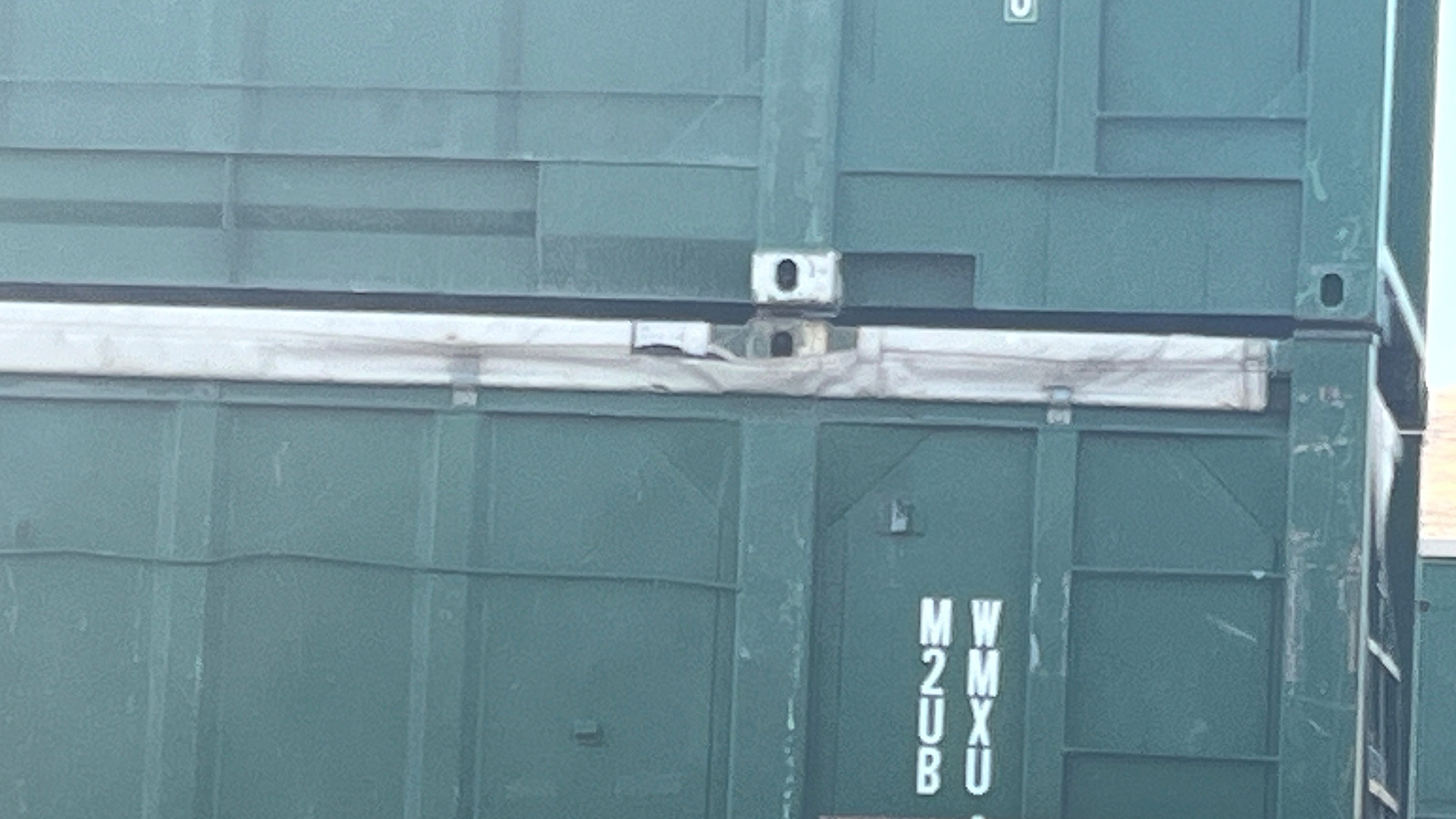 Pictured is a railcar with two containers stacked.