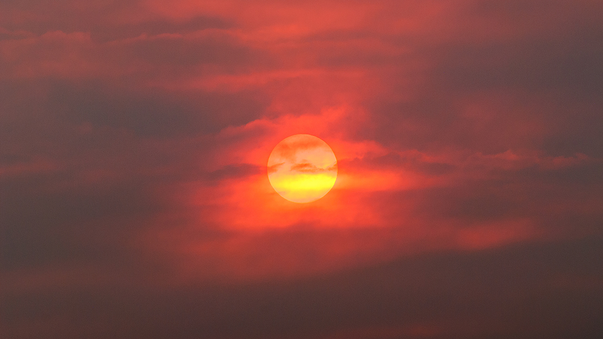 Sun through the haze of wildfire smoke.